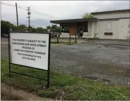  ?? EVAN BRANDT — MEDIANEWS GROUP ?? This sign posted in front of the derelict gas station at the corner of North charlotte and Mervine streets indicates the site might finally get a facelift.