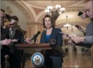  ?? THE ASSOCIATED PRESS ?? House Democratic Leader Nancy Pelosi of California, the speaker-designate for the new Congress in January, talks to reporters after meeting with Senate Minority Leader Chuck Schumer, D-N.Y., as Congress and President Donald Trump bicker over his demand that lawmakers fund a wall along the U.S.-Mexico border, pushing the government to the brink of a partial shutdown, in Washington, Tuesday, Dec. 18, 2018. Without a resolution, parts of the federal government will shut down at midnight Friday.