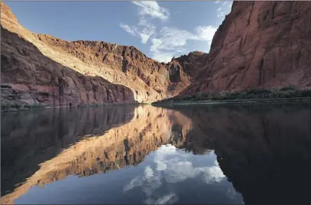  ?? EVEN WITH Carolyn Cole Los Angeles Times ?? this year’s snowpack, Lake Powell, above, and Lake Mead — the Colorado River’s biggest reservoirs — remain at low levels.