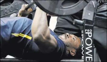  ?? GREGORY PAYAN/THE ASSOCIATED PRESS ?? Texas A&M defensive end Myles Garrett shows his strength in the bench press at the NFL’s annual scouting combine Saturday in Indianapol­is.