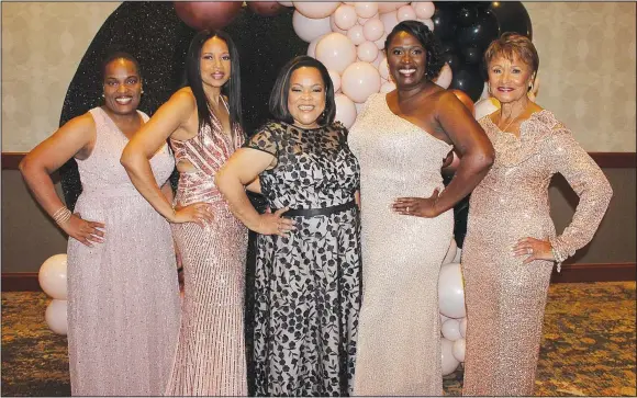  ?? (NWA Democrat-Gazette/Carin Schoppmeye­r) ?? Shawndra Washington (from left); Keisha Hines-Craft, Alpha Kappa Alpha South Central regional director; Joya Hayes; Myra McKenzie-Harris, president of Alpha Kappa Sorority Inc., Phi Alpha Omega Chapter; and Cora Davis, Tea Rose Foundation president, welcome guests to the 23rd annual Celebrity Waiter fundraiser Oct. 22 at the Embassy Suites in Rogers.