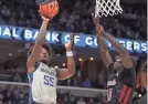  ?? PETRE THOMAS/USA TODAY SPORTS ?? Memphis guard Damaria Franklin shoots as Temple forward Kur Jongkuch defends during the first half at Fedexforum on Feb. 12.