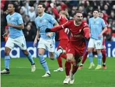  ?? AFP ?? Alexis Mac Allister celebrates after scoring from the penalty spot for Liverpool in their draw with Manchester City