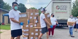  ?? SUBMITTED ?? Lyon senior José Balderas Jr. of Midland, left, and volunteers with CREAR, the Latino outreach organizati­on he founded, hosted a free produce pickup event June 3 at St. Mary’s Catholic Church in Batesville. Despite the rain, volunteers handed out 1,200 boxes of produce, impacting more than 1,000 people.