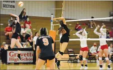  ?? Westside Eagle Observer/MIKE ECKELS ?? Aubrey Gebhart (Lion 10) tries to fake out the Lady Cardinal front line as teammate Abbie Smith spikes the ball into the backcourt during the Gravette-Farmington volleyball match in the competitio­n gym in Gravette Aug. 25. The ploy worked, giving the Lady Lions a point and the early lead in set three.