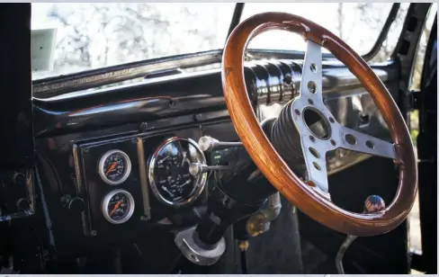  ??  ?? With a host of gauges, a tilt steering column, and an original dash, the interior is an interestin­g mixture of old and new.
