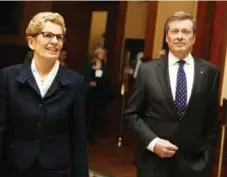  ?? COLIN MCCONNELL/TORONTO STAR FILE PHOTO ?? Mayor John Tory and Premier Kathleen Wynne at Queen’s Park on Dec. 1, 2014, just a few weeks after Tory was elected mayor of Toronto.