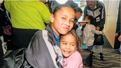  ?? Photo / Paul Taylor ?? Dezaiya Hoeta, 11, won two gold medals and was greeted by her sister Atawhai Hoeta, 5, at Hawke’s Bay Airport as the NZ ITF arrived on Friday afternoon.