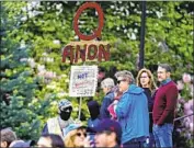  ?? Ted S. Warren Associated Press ?? A SUPPORTER of QAnon protests coronaviru­s stay- at- home orders on May 14 in Olympia, Wash.