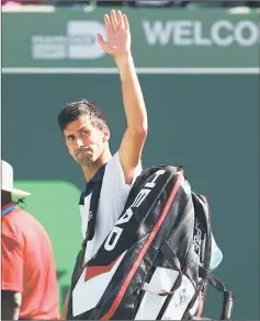  ??  ?? Djokovic waves to the crowd after losing to Benoit Paire of France during the Miami Open at the Crandon Park Tennis Centre in Key Biscayne, Florida. — AFP photo