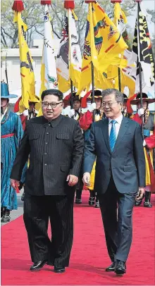  ?? YOUNG HO
KOREA SUMMIT PRESS POOL ?? North Korean leader Kim Jong Un, left, with South Korean President Moon Jae-in Friday before their meeting at the border village of Panmunjom in the Demilitari­zed Zone, South Korea.