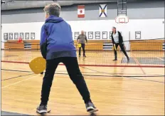  ?? SARA ERICSSON ?? Connor Sunderland, 10, plays pickleball with Digby Area Recreation Commission director Bob Powell and active living manager Cara Sunderland.