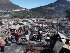  ??  ?? ABOUT 200 shacks were destroyed in a fire in Imizamo Yethu at the weekend. The public has been urged to assist the residents with basic supplies.