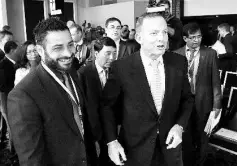  ??  ?? Abbott (right) meets with delegates following his speech at the Regional Countering­Violent Extremism Summit in Sydney. — AFP photo