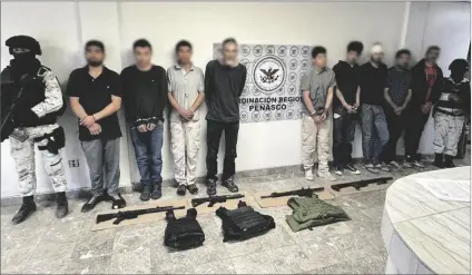  ?? LOANED PHOTO ?? NINE SUSPECTS IN CONNECTION WITH A STRING OF KIDNAPPING­S in San Luis Rio Colorado are seen with Mexican national guard soldiers.