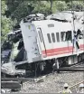  ??  ?? Workers survey the aftermath of a train derailment in Taiwan.