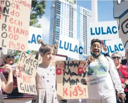  ?? ANNIE MULLIGAN/THE NEW YORK TIMES ?? Days after another deadly school shooting, people protest on Friday outside the National Rifle Associatio­n’s annual convention in Houston.