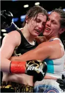  ??  ?? Katie Taylor and Argentina’s Victoria Bustos embrace at the end of their World lightweigh­t unificatio­n bout