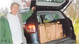  ?? MARTHA THORN PHOTOS ?? Bill Maynard has his vehicle loaded with donations for the first of two trips to St. Luke’s Episcopal Church’s food pantry.