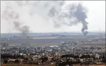  ?? ASSOCIATED PRESS ?? Smoke billows from fires in Ras al-Ayn, Syria, on Sunday. The Kurds have evacuated the border town as part of the cease-fire.