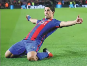  ?? MANU FERNANDEZ / AP ?? Barcelona’s Luis Suarez celebrates after scoring during Wednesday’s Copa del Rey round of 16 second leg match against Athletic Bilbao at Camp Nou. Barcelona won 3-1 and advanced 4-3 on aggregate.