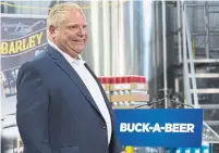  ?? LARS HAGBERG/THE CANADIAN PRESS ?? Premier Doug Ford announces his buck-a-beer plan at Barley Days brewery in Picton, Ont., Tuesday.