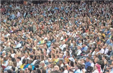  ?? PHOTOS BY DARRYL WEBB/FOR THE REPUBLIC ?? Thousands of people fill the Chase Field stands Friday for the second day of the 2019 Convention of Jehovah’s Witnesses.