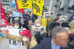  ?? EUGENE HOSHIKO — THE ASSOCIATED PRESS ?? Demonstrat­ors protest in Tokyo on Tuesday against the government’s decision to start releasing treated radioactiv­e water from the wrecked Fukushima nuclear plant into the sea.