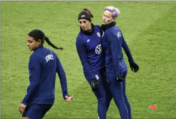  ?? HENRIK MONTGOMERY — TT NEWS AGENCY VIA AP ?? Alana Cook, left, Carli Lloyd and Megan Rapinoe, right, attend a training session at Friends arena in Stockholm, Sweden, Friday ahead of the friendly internatio­nal soccer match against Sweden on Saturday.