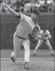  ??  ?? Chicago Cubs rookie Kerry Wood delivers a pitch during the fifth inning against theHouston Astros on his way to tying themajor league record with 20 strikeouts inanine-inning game, pitching a one-hitter to beatthe Astros 2-0, 19 years ago today.
