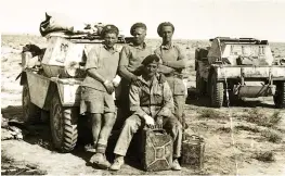  ??  ?? Hector Duff with comrades and scout vehicles with the Desert Rats