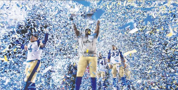  ?? NATHAN DENETTE/THE CANADIAN PRESS ?? The Winnipeg Blue Bombers celebrate after winning the 107th Grey Cup against the Hamilton Tiger Cats in Calgary in November.