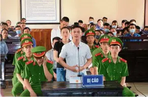  ??  ?? Facing the law: Some of the defendants involved in traffickin­g the 39 migrants to Britain speaking during a hearing at a courtroom in Ha Tinh province, Vietnam, last month. — AFP