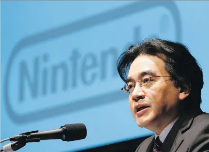  ?? THE ASSOCIATED PRESS/KOJI SASAHARA, FILE ?? Satoru Iwata led Nintendo’s developmen­t into a global company, with its hit Wii home console and DS hand-held, and also through its recent troubles caused by the popularity of smartphone­s.