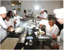  ?? ?? Students from Zimbabwean universiti­es who visited Spain, courtesy of Tourism and Hospitalit­y Industry patron First Lady Dr Auxillia Mnangagwa, being taught how to prepare different types of dishes at the Basque Culinary Centre in Donostia, San Sabastian, Spain, yesterday