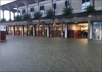  ?? Courtesy of the Pine Bluff Fire Department ?? The Fire Department building was inundated with water during Monday evening’s flooding in Pine Bluff.