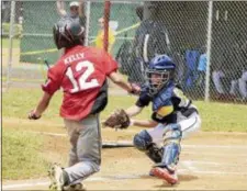  ?? JOHN BLAINE — FOR THE TRENTONIAN ?? Bordentown catcher Ryan Babeck, right, puts the tase on Lawrence’s Robert Kelly, left, before he can score during the second inning of the District 12 Little League game on Sunday.