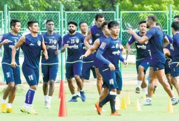  ?? R. RAVINDRAN ?? Hoping for a turnaround: Chennaiyin FC players during a training session at the SRMC ground in Chennai. The team is yet to win a game at home this season.