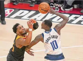  ?? Rick Bowmer/associated Press ?? Jazz guard Donovan Mitchell, left, says the defense of Mavericks forward Dorian Finney-smith (10) has given him trouble in their playoff series.