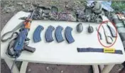  ?? HT PHOTO ?? Arms, ammunition and other warlike stores, including one AK rifle, three magazines, two grenades, dresses and bags were recovered from the slain Pak gunman.