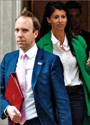  ?? ?? IN LOVE: Matt Hancock with former aide Gina Coladangel­o, leaving No10 in May 2020