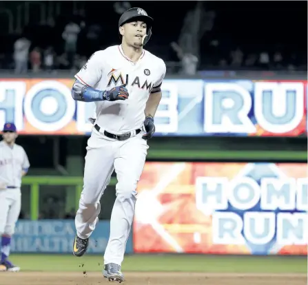  ?? THE ASSOCIATED PRESS FILES ?? Giancarlo Stanton hit 59 home runs and tallied 132 RBI for the Miami Marlins last season en route to being named National League MVP. Miami traded the slugger to the Yankees, further bolstering an already powerful lineup.