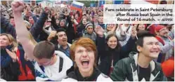  ??  ?? Fans celebrate in Saint Petersburg after Russia beat Spain in the Round of 16 match. –