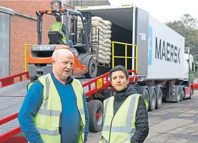  ??  ?? STARK WARNING: David Chalmers and Mairi Gougeon at AJ Allan Potato Merchants in Brechin yesterday