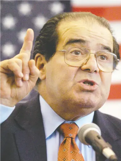  ?? GAVIN AVERILL / THE HATTIESBUR­G AMERICAN VIA THE ASSOCIATED PRESS FILES ?? U.S. Supreme Court Justice Antonin Scalia speaks at an event in Mississipp­i in 2004. Scalia, who died in 2016, was a key promoter of originalis­m, a judicial interpreta­tion less prominent among Canadian judges and legal scholars.