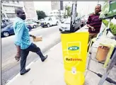  ??  ?? A picture taken on Oct 27 shows a man walking past a MTN notice board in Lagos. The chief executive of South Africa-based mobile phone operator MTN has resigned over a $5.2 billion fine imposed on the company in Nigeria, a statement said on Nov 9. (AFP)