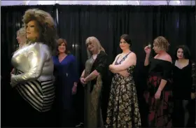  ?? (AP PHOTO/WONG MAYE-E) ?? From left, Deborah Smith; Anthony Bovenzi, aka Nikita Le Femme; Lisa Smith; Samantha Ambrose; Juliana Wall; Phoebe Winter; and Sarah Langer wait to walk down the runway during the TransFORME­D fashion show on Friday, Jan. 31, 2020, in Boston. For this event, models get to walk down the runway three times, dressed in three different themes of their choosing. The list includes: Role Model, Hero, Evening of Elegance, Fantasy and Hobby.