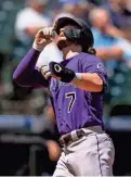  ?? STEPHEN BRASHEAR/USA TODAY SPORTS ?? Rockies second baseman Brendan Rodgers celebrates after hitting a home run against the Mariners on Wednesday in Seattle.