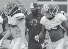  ?? UNIVERSITY OF VIRGINIA ATHLETICS FILE ?? Virginia coach Bronco Mendenhall, shown running preseason practice in Charlottes­ville, was determined that topranked Clemson wouldn’t again embarrass the Cavaliers by getting beyond their defensive backs.