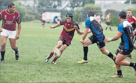  ?? Photo: KRIS DANDO ?? Massive loss: Davey Hotene puts a kick through for the Vikings premier side that was a hodge podge of players and uniforms against University on Saturday.